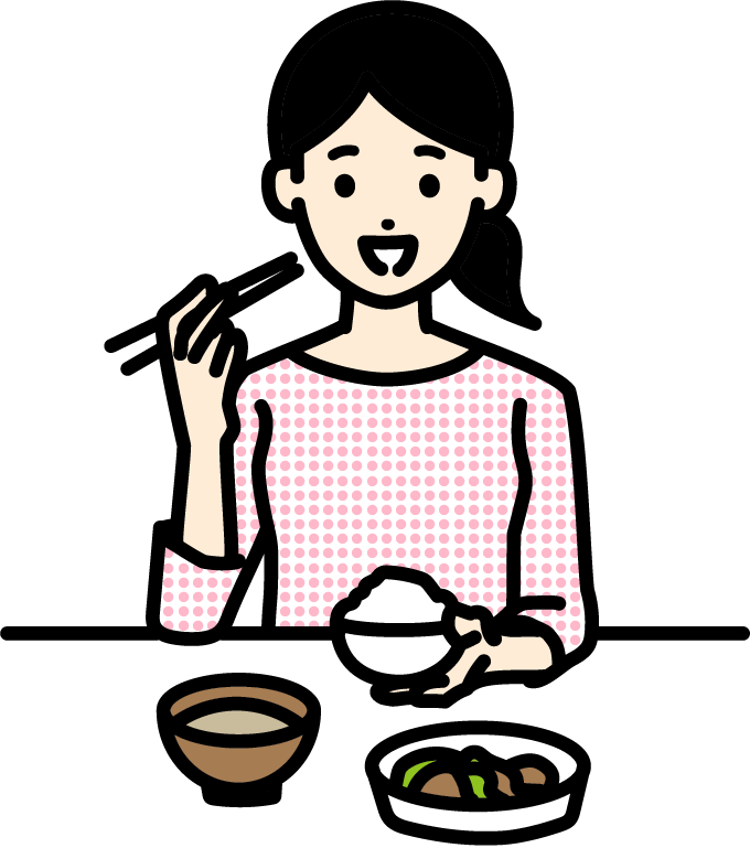 食事をするインプラント治療中の女性